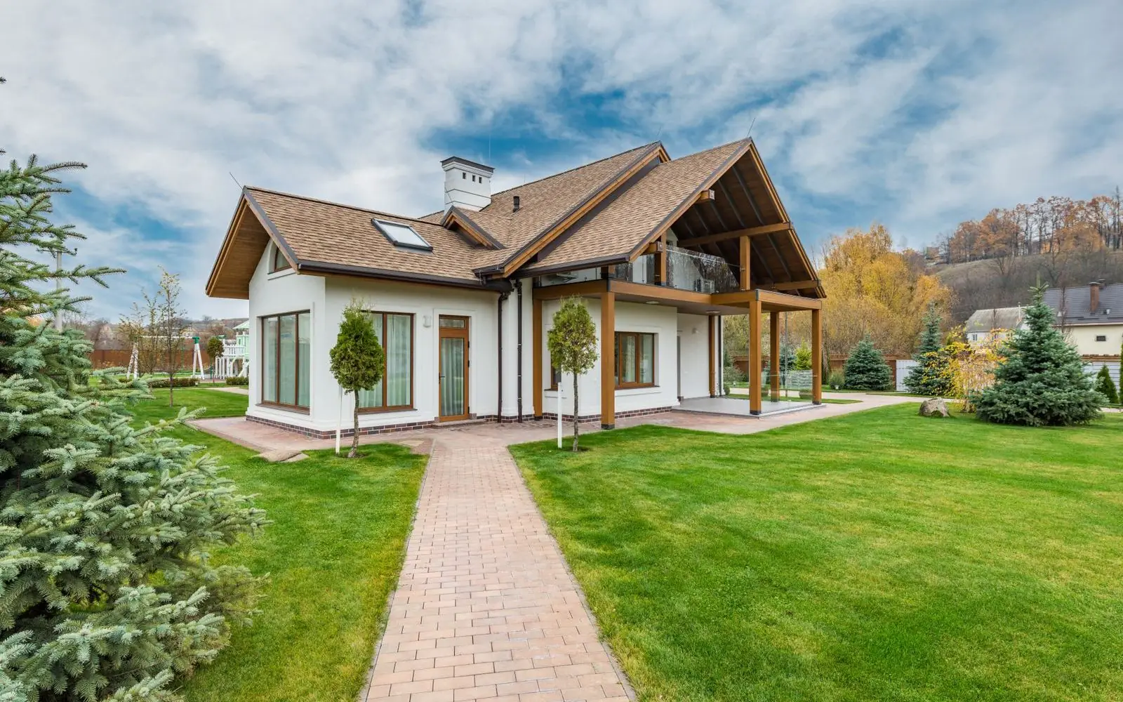 A completed home with a paved path and garden