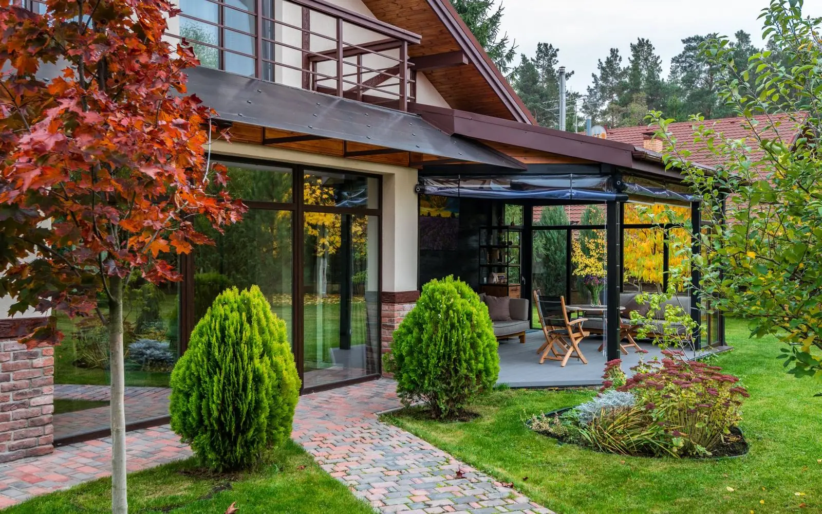 A modern cottage with glazed living space and garden